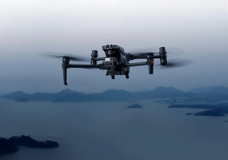 Survey drone flying over a coastal city for aerial mapping
